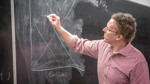 Professor at chalk board
